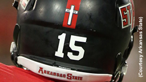 Football team forced to remove Christian crosses from helmets
